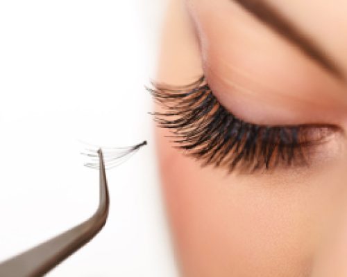 Woman eye with long eyelashes. Eyelash extension Woman eye with long eyelashes. Eyelash extension